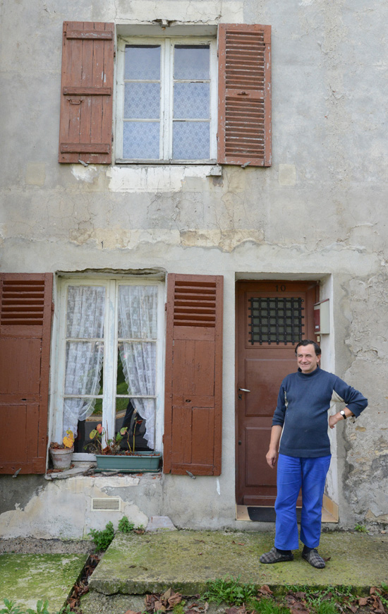 Monsieur Essel in front of his house in Goussainville, a ghost town that inspires the art of traveling (Photo © Meredith Mullins)