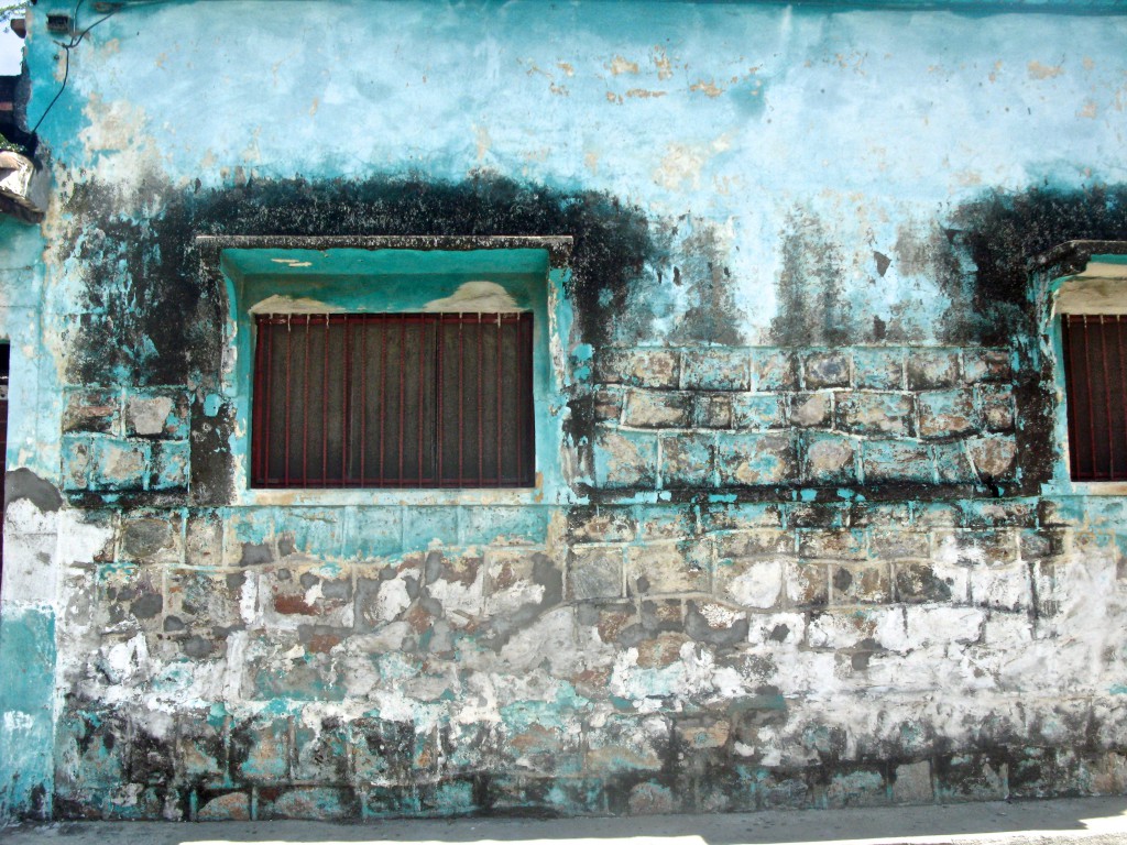 Exterior wall with stained blue patterns, showing how the art of urban exploration makes you see things differently. (image © Eva Boynton)