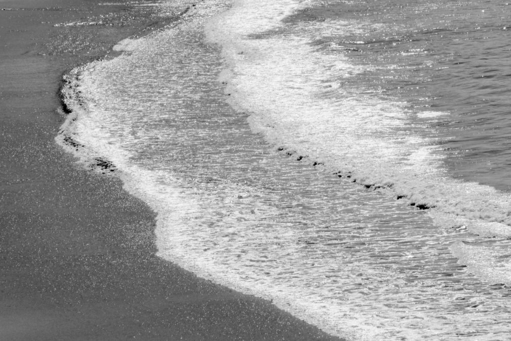 Waves on the Pacific Coast, near the Big Sur New Camaldoli Hermitage, a place for seeking silence and challenging the cultural traditions of Labor Day. (Image © Meredith Mullins.)