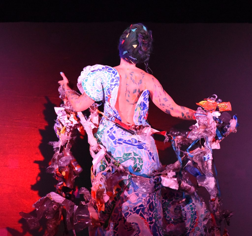 A mosaic dress and wrap modeled by Christy Carico at the 2018 Big Sur Fashion Show, a cultural encounter with the spirit of community. (Image © Meredith Mullins.)