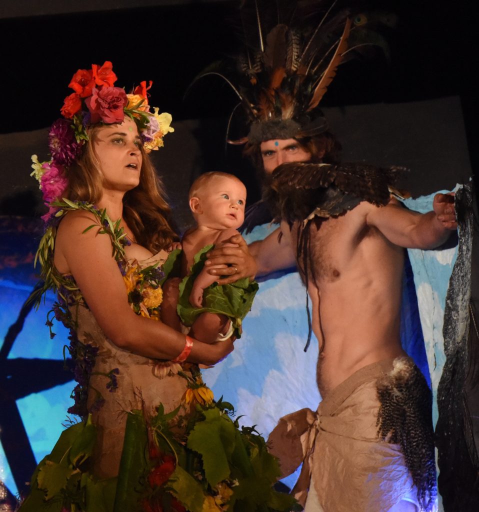 Mother earth and father sky and a baby at the 2018 Big Sur Fashion Show, a cultural encounter with the spirit of community. (Image © Meredith Mullins.)