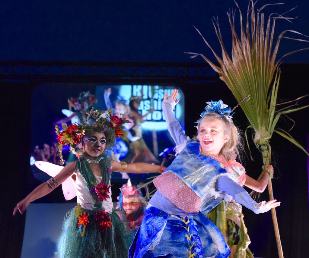 Kids dancing at the 2018 Big Sur Fashion Show, a culture encounter with the spirit of community. (Image © Meredith Mullins.)