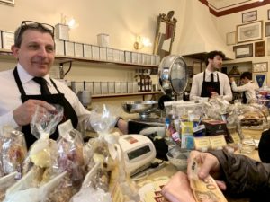 Baristas and customers in an Italian cafe and bakery evoke memories of life before lockdown impacted Italy's cultural traditions. (Image © Joyce McGreevy)